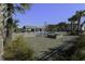 Community pool with lounge chairs and fire pit at 1209 Hammrick Ln, Johns Island, SC 29455