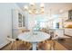 Bright dining room features a round wooden table with four chairs, and a large hutch at 1521 Martel St # C-1, Mount Pleasant, SC 29464