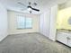 Bright bedroom with ceiling fan, carpet, and large closet at 1530 Fort Johnson Rd # 2 K, Charleston, SC 29412
