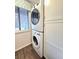 Stackable washer and dryer in laundry room with extra cabinets at 1530 Fort Johnson Rd # 2 K, Charleston, SC 29412