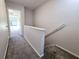 Hallway with carpeted floors leading to upstairs at 1530 Fort Johnson Rd # 2 K, Charleston, SC 29412