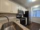Modern kitchen with stainless steel appliances and granite counters at 1530 Fort Johnson Rd # 2 K, Charleston, SC 29412