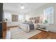 Spacious bedroom with hardwood floors, large windows, and a ceiling fan at 1583 Paradise Lake Dr, Mount Pleasant, SC 29464