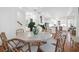 Open concept dining room with kitchen view and hardwood floors at 1583 Paradise Lake Dr, Mount Pleasant, SC 29464