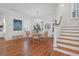 Elegant dining room features hardwood floors, chandelier, and white walls at 1583 Paradise Lake Dr, Mount Pleasant, SC 29464