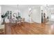 Bright dining room with hardwood floors, staircase, and entryway view at 1583 Paradise Lake Dr, Mount Pleasant, SC 29464