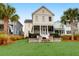 Charming two-story house with landscaped yard and fire pit at 1583 Paradise Lake Dr, Mount Pleasant, SC 29464
