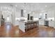Modern kitchen with white cabinets, granite counters, and hardwood floors at 1583 Paradise Lake Dr, Mount Pleasant, SC 29464