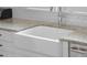 White farmhouse sink with chrome faucet and granite countertop at 1583 Paradise Lake Dr, Mount Pleasant, SC 29464