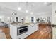 Spacious kitchen with island, stainless steel appliances, and hardwood floors at 1583 Paradise Lake Dr, Mount Pleasant, SC 29464