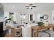 Bright living room with fireplace, hardwood floors, and access to porch at 1583 Paradise Lake Dr, Mount Pleasant, SC 29464