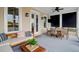 Relaxing screened porch with seating area and dining table at 1583 Paradise Lake Dr, Mount Pleasant, SC 29464