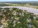 Aerial view showing home's location in a quiet, tree-lined neighborhood at 2028 Coker Ave, Charleston, SC 29412