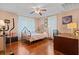 Bedroom with hardwood floors, a metal bed frame, and home office space at 2028 Coker Ave, Charleston, SC 29412