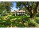 Cute cottage style home with lush landscaping and large shade tree at 2028 Coker Ave, Charleston, SC 29412