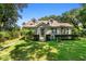 Charming house with a grassy yard and mature trees at 2028 Coker Ave, Charleston, SC 29412