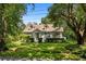 Attractive house nestled amongst mature trees and a lush lawn at 2028 Coker Ave, Charleston, SC 29412
