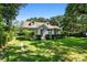 Quaint house with a spacious green lawn and beautiful landscaping at 2028 Coker Ave, Charleston, SC 29412