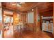 Upstairs hallway with wood walls, a small table, and access to other rooms at 2028 Coker Ave, Charleston, SC 29412