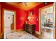 Hallway with red walls, a wooden dresser, and patterned rug at 2028 Coker Ave, Charleston, SC 29412