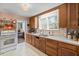 Bright kitchen with wood cabinets and a double sink at 2028 Coker Ave, Charleston, SC 29412