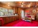 Cozy kitchenette with wood cabinets and a red carpet at 2028 Coker Ave, Charleston, SC 29412