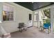 Relaxing screened porch with two chairs and access to yard at 2028 Coker Ave, Charleston, SC 29412