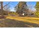 Large backyard with mature trees and open grassy area at 2289 Highway 35, Pineville, SC 29468