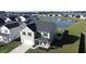 Aerial view of two-story house near a pond at 268 Lucca Dr, Summerville, SC 29486