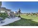 Large backyard with a patio, grassy area, and a wooden fence at 268 Lucca Dr, Summerville, SC 29486