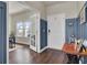 Bright entry with hardwood floors, blue accent wall, and office view at 268 Lucca Dr, Summerville, SC 29486