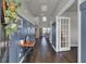 Bright entryway with blue accent wall, hardwood floors, and a vintage table at 268 Lucca Dr, Summerville, SC 29486