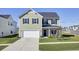 Two-story house with a gray roof and white garage, situated on a landscaped lawn at 268 Lucca Dr, Summerville, SC 29486