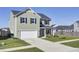Two-story house with a gray roof and white garage, situated on a landscaped lawn at 268 Lucca Dr, Summerville, SC 29486
