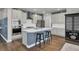 Modern kitchen with island, stainless steel appliances, and a view of the dining room at 268 Lucca Dr, Summerville, SC 29486
