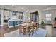 Modern kitchen with stainless steel appliances and an island, adjacent to dining area at 268 Lucca Dr, Summerville, SC 29486