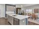 Modern kitchen with island, stainless steel appliances, and a dining area at 268 Lucca Dr, Summerville, SC 29486