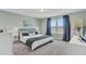 Main bedroom with plush carpeting and large windows with lake view at 268 Lucca Dr, Summerville, SC 29486
