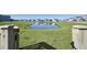 Open gate reveals a scenic pond view in a peaceful neighborhood at 268 Lucca Dr, Summerville, SC 29486