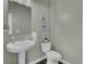 Small powder room with pedestal sink and dark wood floors at 268 Lucca Dr, Summerville, SC 29486