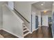 Elegant staircase with dark wood steps and neutral walls at 268 Lucca Dr, Summerville, SC 29486