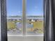 Scenic pond view visible from a window with gray curtains at 268 Lucca Dr, Summerville, SC 29486
