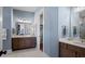 Double vanity bathroom with blue walls and marble floors at 320 Trailmore Ln, Summerville, SC 29486