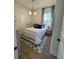 Bright bedroom with white bedding and patterned rug at 320 Trailmore Ln, Summerville, SC 29486
