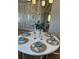 Round dining table with seating for six in a bright room at 320 Trailmore Ln, Summerville, SC 29486
