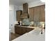 Modern kitchen with wood cabinets, quartz countertops, and stainless steel appliances at 320 Trailmore Ln, Summerville, SC 29486