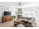 Living room with sectional sofa, fireplace, and built-in shelving at 4110 Perrine St, Charleston, SC 29414