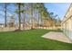 Spacious backyard with a fenced-in lawn and patio area at 444 Longleaf Dr, Summerville, SC 29483