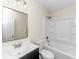 Clean bathroom with a white tub/shower combo, dark vanity, and a large mirror at 444 Longleaf Dr, Summerville, SC 29483