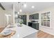 Modern kitchen features a large island with quartz countertops and dark green cabinetry at 444 Longleaf Dr, Summerville, SC 29483